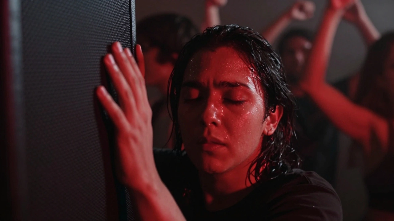 Close-up of hands gripping a speaker, eyes closed, lost in the rhythm of underground techno music.